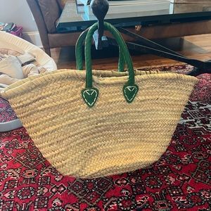 Straw shopping bag, green leather handles